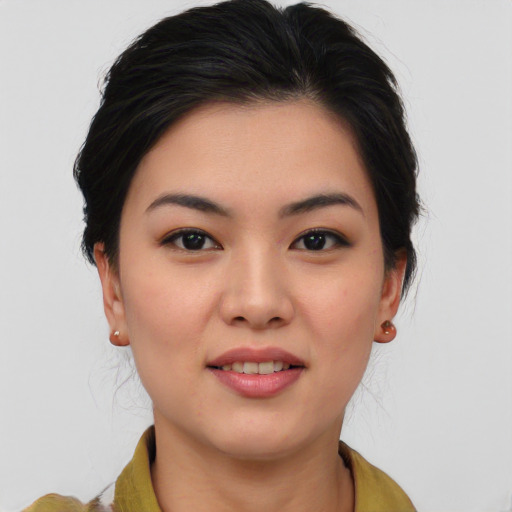 Joyful asian young-adult female with medium  brown hair and brown eyes