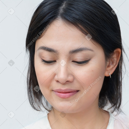 Joyful asian young-adult female with medium  brown hair and brown eyes