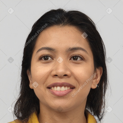 Joyful latino young-adult female with medium  brown hair and brown eyes