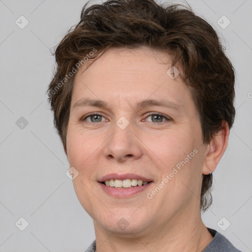 Joyful white adult female with short  brown hair and brown eyes