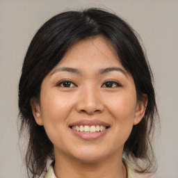 Joyful white young-adult female with medium  brown hair and brown eyes