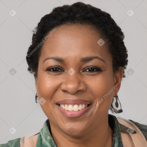 Joyful black adult female with short  brown hair and brown eyes