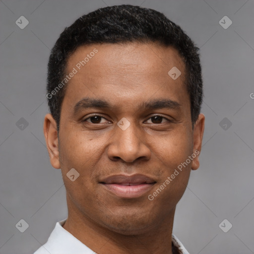 Joyful latino young-adult male with short  brown hair and brown eyes