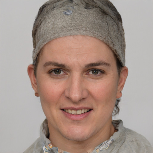 Joyful white adult female with short  brown hair and grey eyes