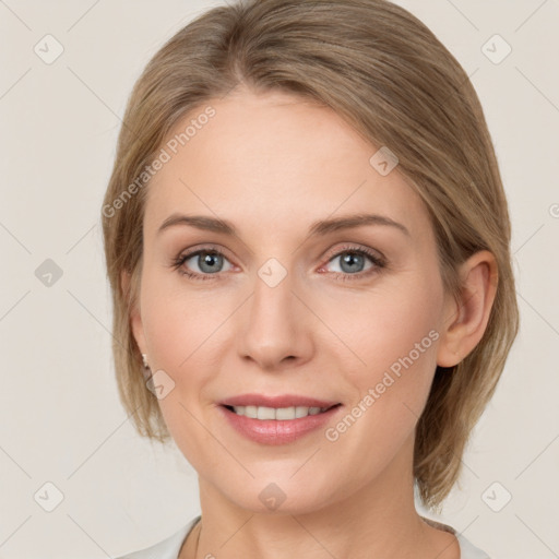 Joyful white adult female with medium  brown hair and grey eyes