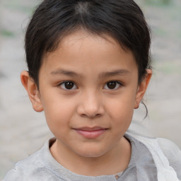 Joyful white child female with short  brown hair and brown eyes