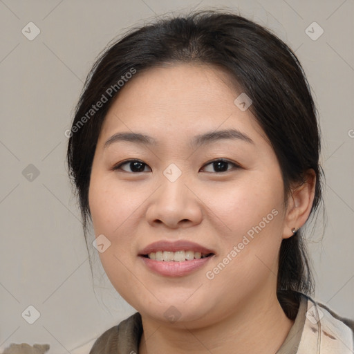 Joyful asian young-adult female with medium  brown hair and brown eyes