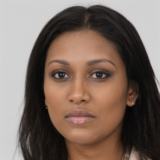 Neutral black young-adult female with long  brown hair and brown eyes