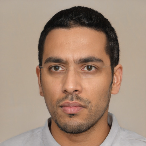 Neutral latino young-adult male with short  black hair and brown eyes