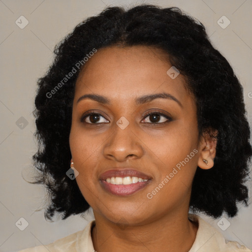 Joyful black young-adult female with medium  black hair and brown eyes