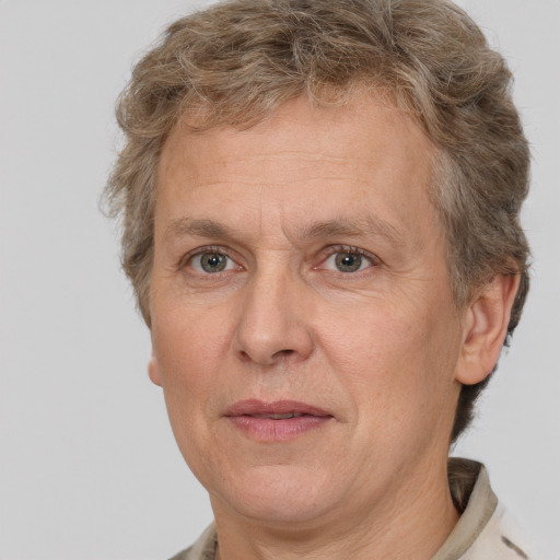 Joyful white middle-aged male with short  brown hair and brown eyes