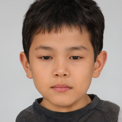 Neutral asian child male with short  brown hair and brown eyes
