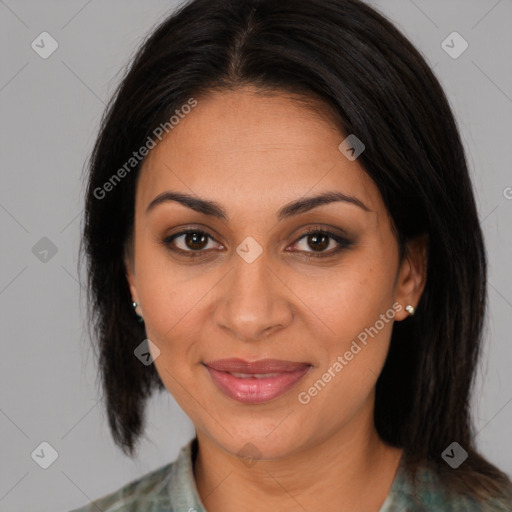 Joyful latino adult female with medium  brown hair and brown eyes