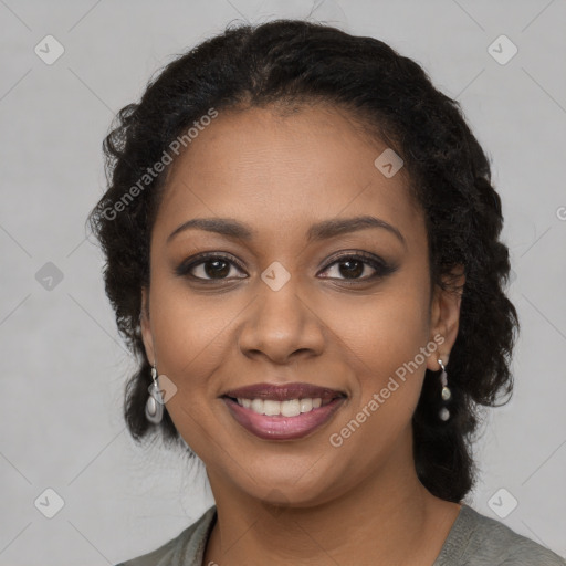 Joyful black young-adult female with long  brown hair and brown eyes