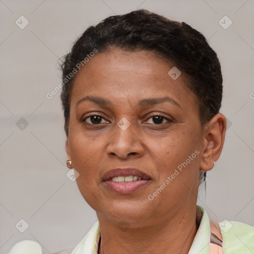 Joyful latino adult female with short  brown hair and brown eyes