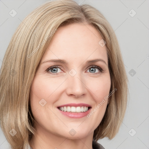 Joyful white young-adult female with medium  brown hair and blue eyes