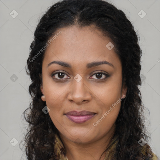 Joyful black young-adult female with long  brown hair and brown eyes