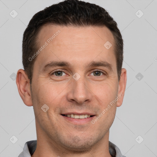 Joyful white adult male with short  brown hair and brown eyes