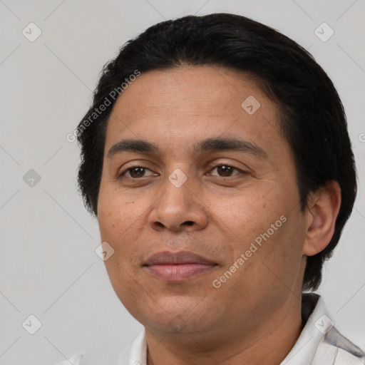 Joyful latino adult male with short  black hair and brown eyes