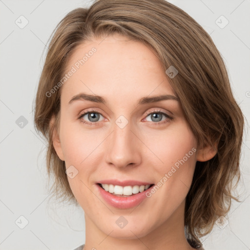 Joyful white young-adult female with medium  brown hair and green eyes