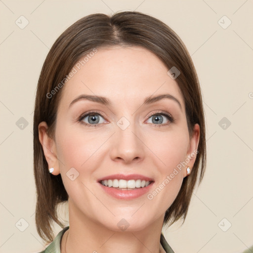 Joyful white young-adult female with medium  brown hair and green eyes