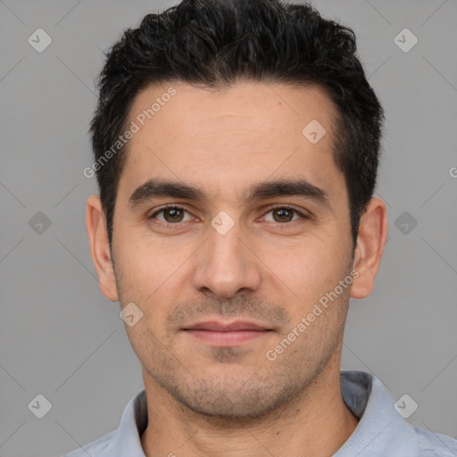 Joyful white young-adult male with short  black hair and brown eyes