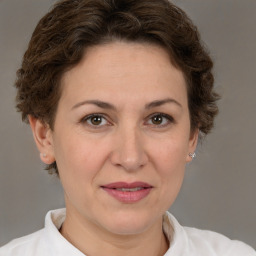 Joyful white adult female with short  brown hair and brown eyes