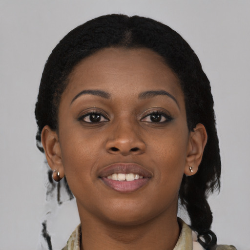 Joyful black young-adult female with medium  brown hair and brown eyes