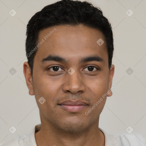 Joyful black young-adult male with short  black hair and brown eyes