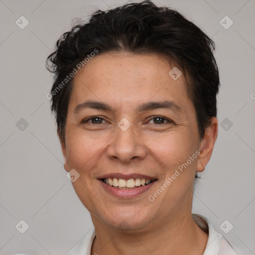 Joyful white adult female with short  brown hair and brown eyes