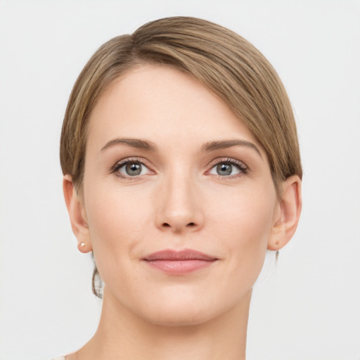 Joyful white young-adult female with short  brown hair and grey eyes