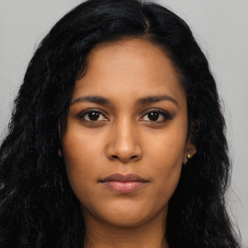 Neutral latino young-adult female with long  black hair and brown eyes