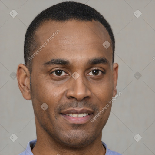 Joyful black young-adult male with short  brown hair and brown eyes