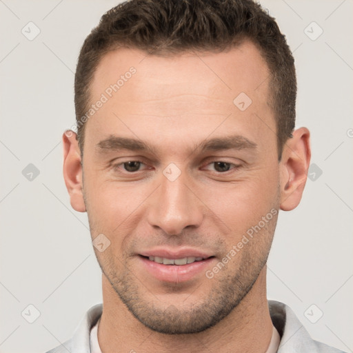 Joyful white young-adult male with short  brown hair and brown eyes