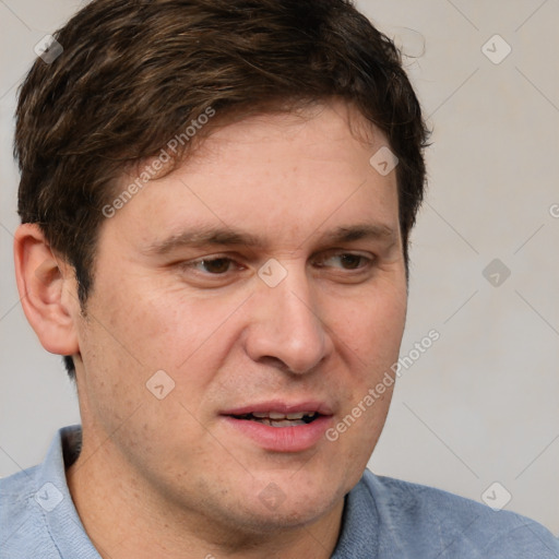 Joyful white adult male with short  brown hair and grey eyes