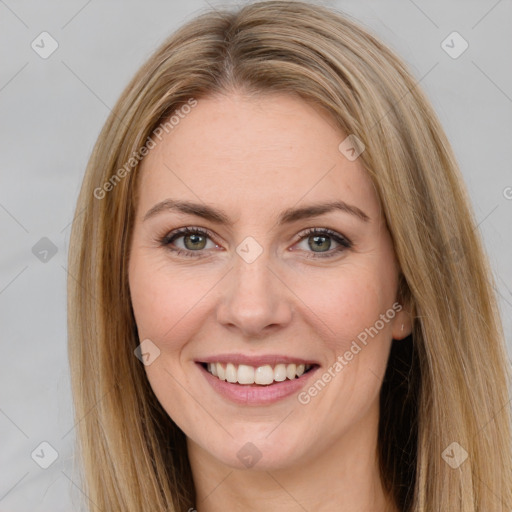 Joyful white young-adult female with long  brown hair and brown eyes