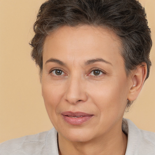 Joyful white adult female with short  brown hair and brown eyes