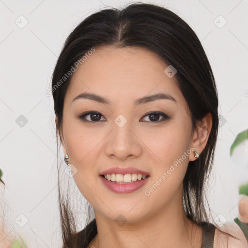 Joyful asian young-adult female with long  brown hair and brown eyes