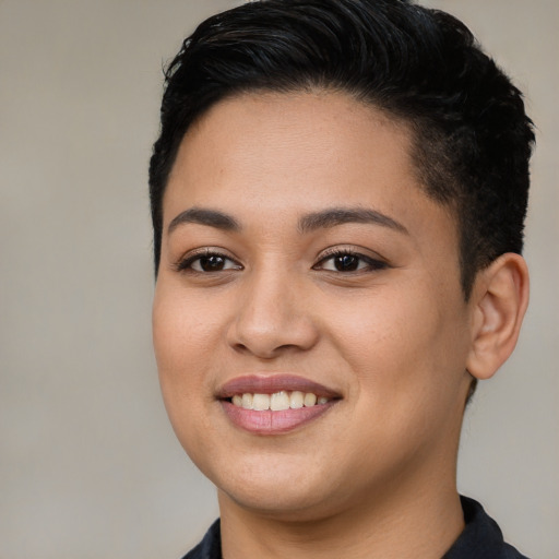 Joyful latino young-adult female with short  brown hair and brown eyes