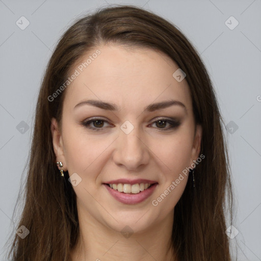 Joyful white young-adult female with long  brown hair and brown eyes