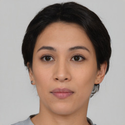 Neutral asian young-adult female with medium  brown hair and brown eyes