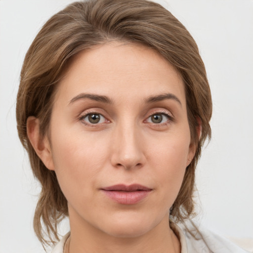 Neutral white young-adult female with medium  brown hair and grey eyes