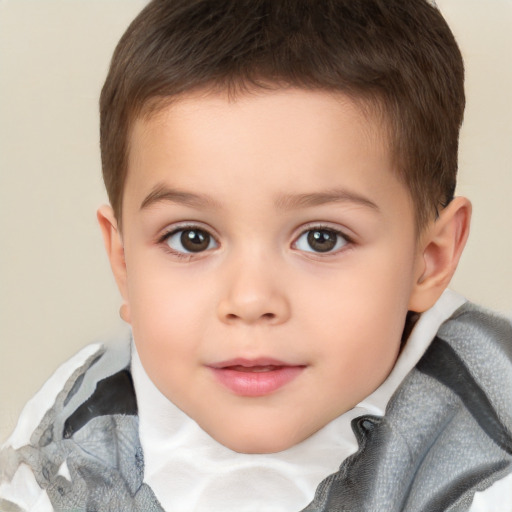 Joyful white child male with short  brown hair and brown eyes