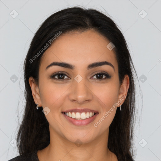 Joyful latino young-adult female with long  brown hair and brown eyes