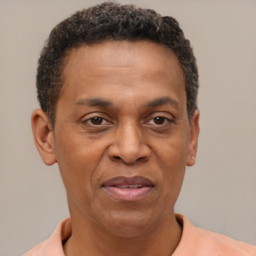 Joyful latino adult male with short  brown hair and brown eyes
