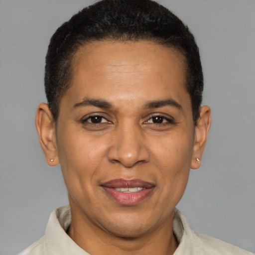 Joyful latino adult female with short  brown hair and brown eyes