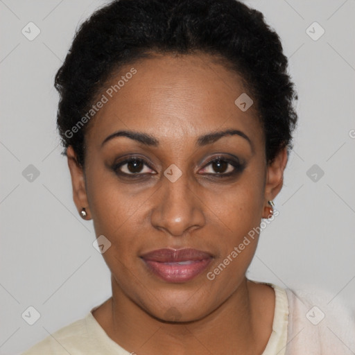 Joyful black young-adult female with short  black hair and brown eyes