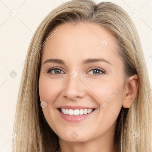 Joyful white young-adult female with long  brown hair and brown eyes