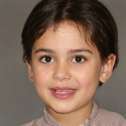 Joyful white child female with short  brown hair and brown eyes