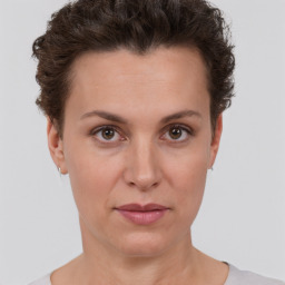 Neutral white young-adult female with short  brown hair and brown eyes